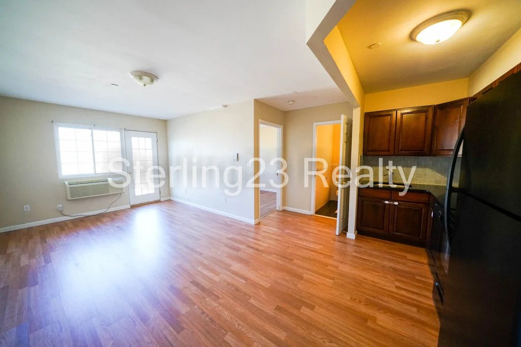 Large living space with dark cabinets