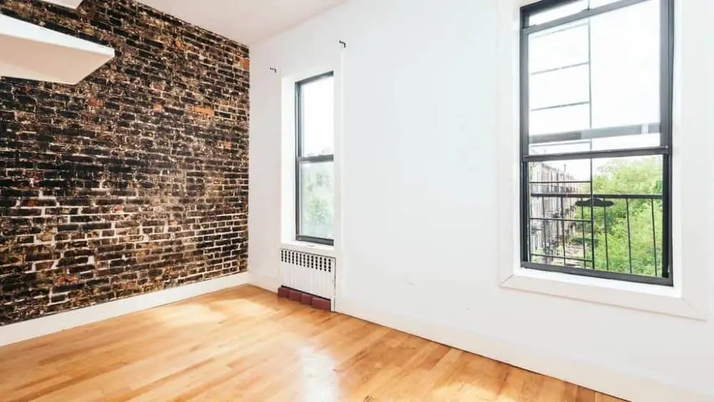 Brooklyn apartment with exposed brick and bright ilving room