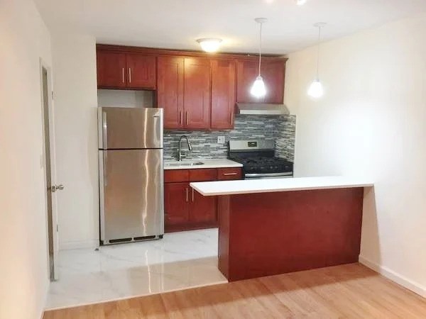 Queens kitchen with stainless steel appliances