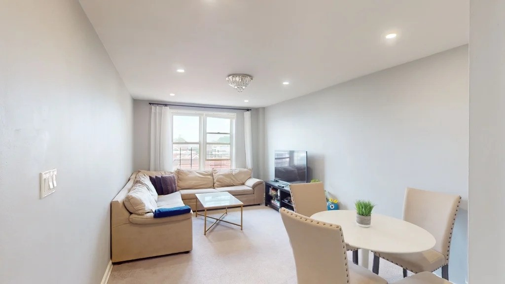 Living room in Queens with recessed lighting