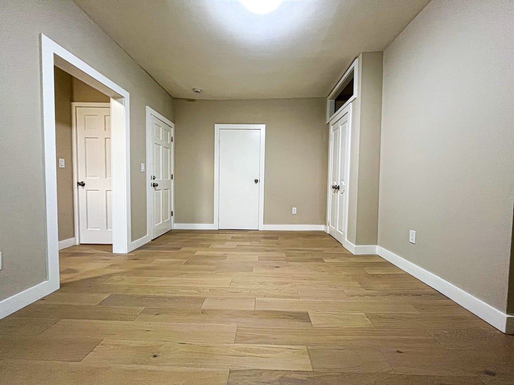 Brooklyn living room with multiple doors