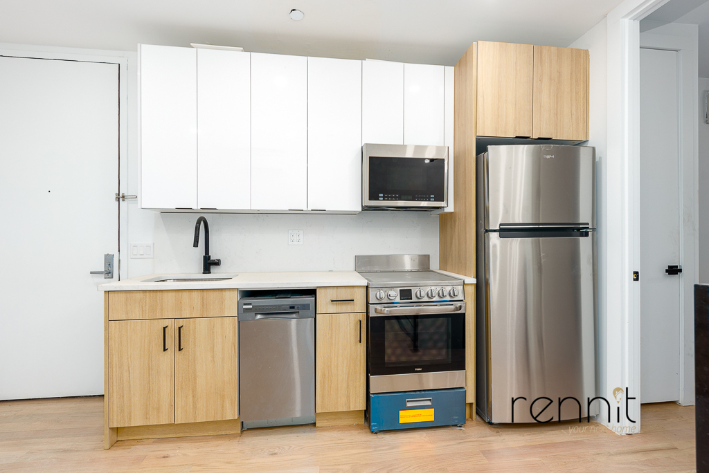 Sleek Queens kitchen in a one-bedroom apartment