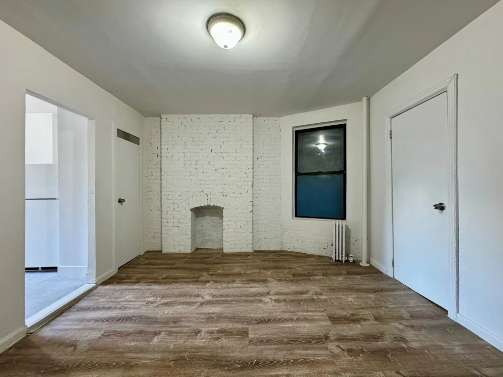 Manhattan living room with exposed brick fireplace