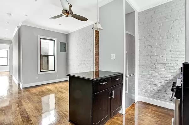 Hell's Kitchen walk-up apartment with exposed brick walls