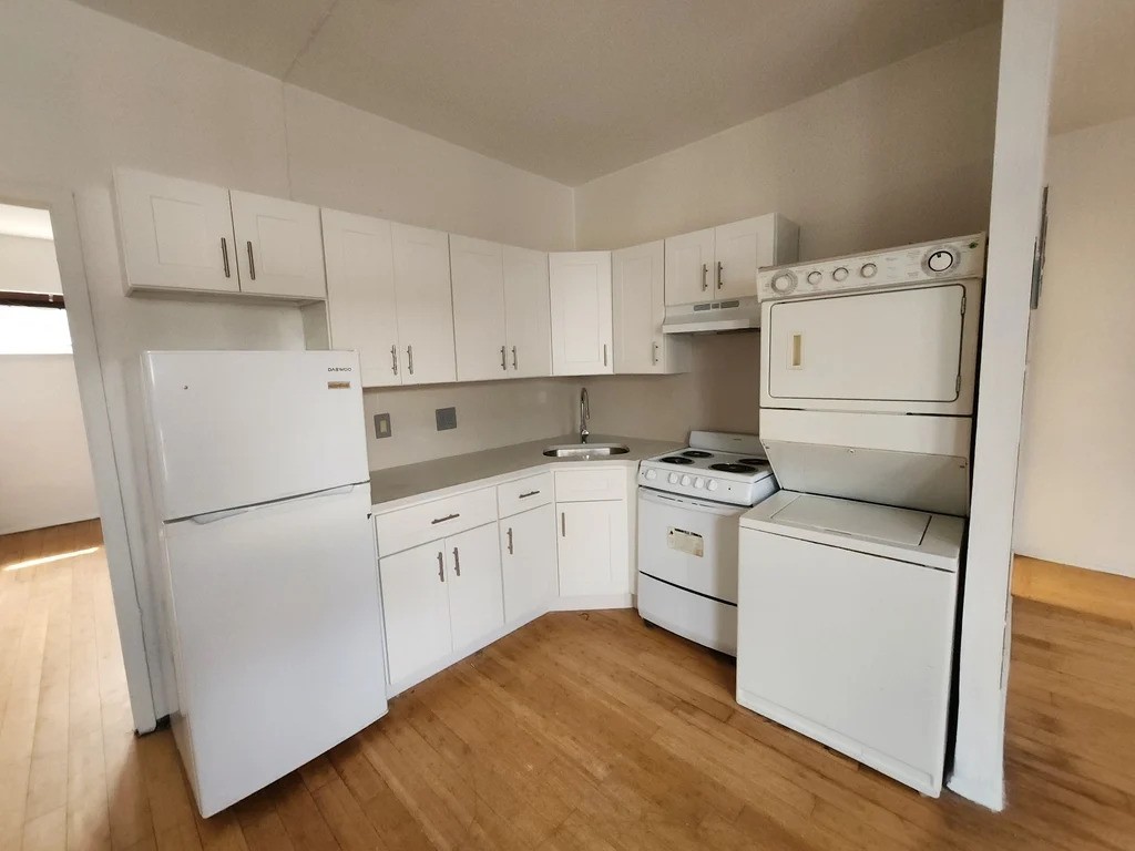 Queens one-bedroom apartment with a white kitchen