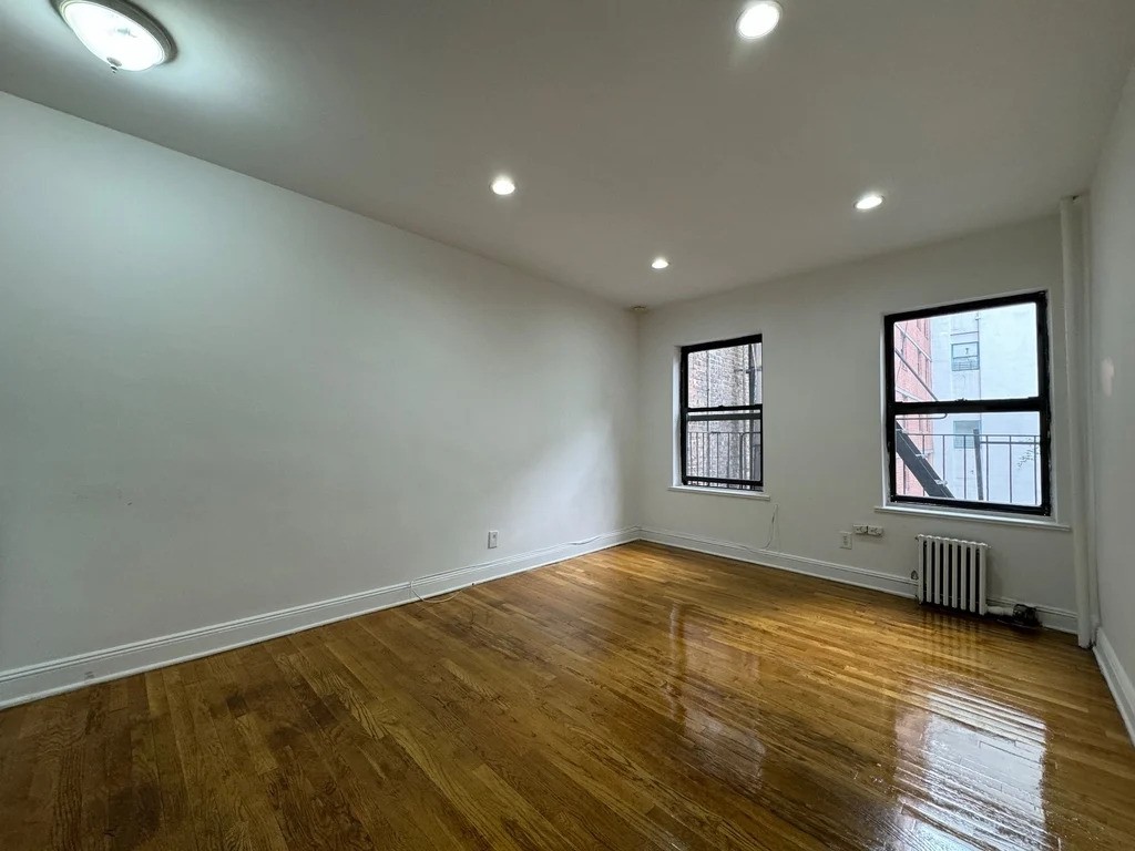 Manhattan apartment with recessed lighting and hardwood floors