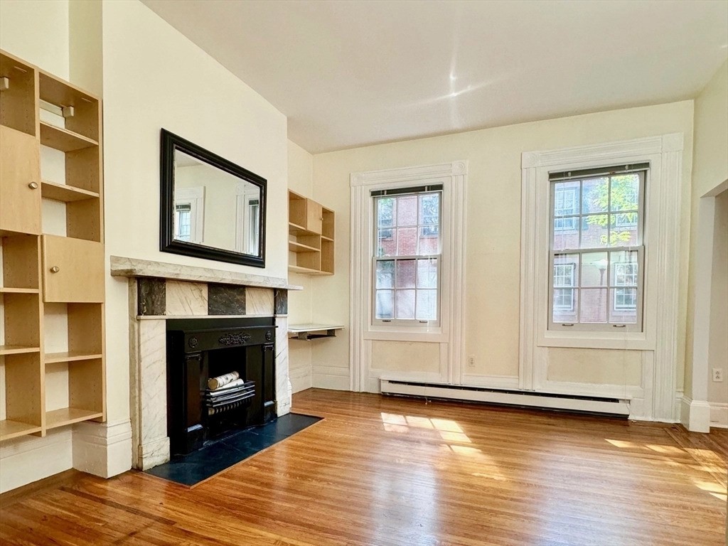 Living room in Boston with a decorative fireplace