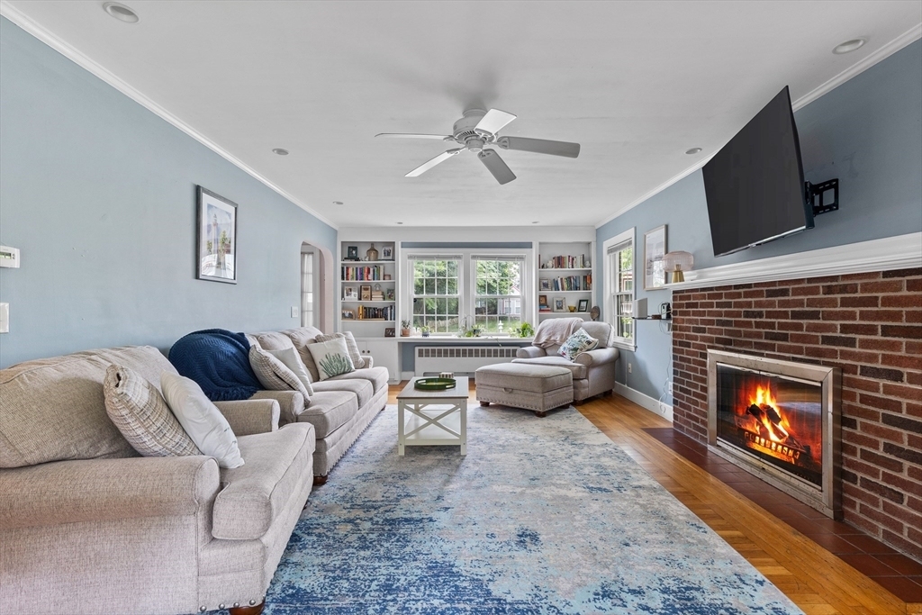 Living room in a Boston apartment with a brick fireplace