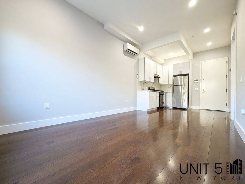 Brooklyn kitchen and living room with hardwood floors