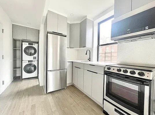 Modern kitchen with laundry in a Brooklyn apartment