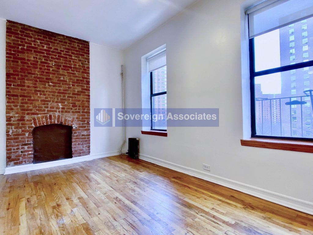 Manhattan apartment with an exposed brick fireplace