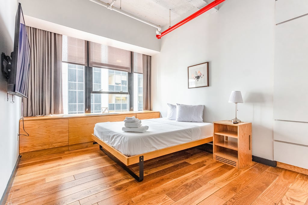 Bedroom with natural light near a ferry stop