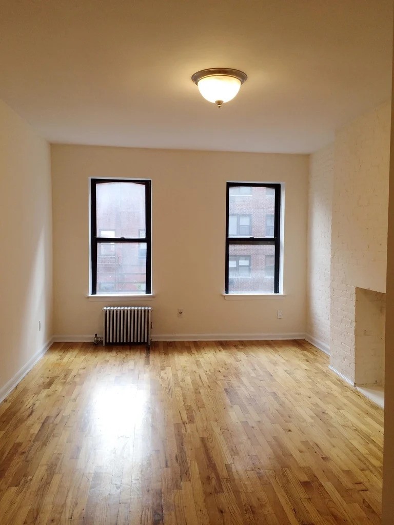 Manhattan apartment with exposed brick fireplace