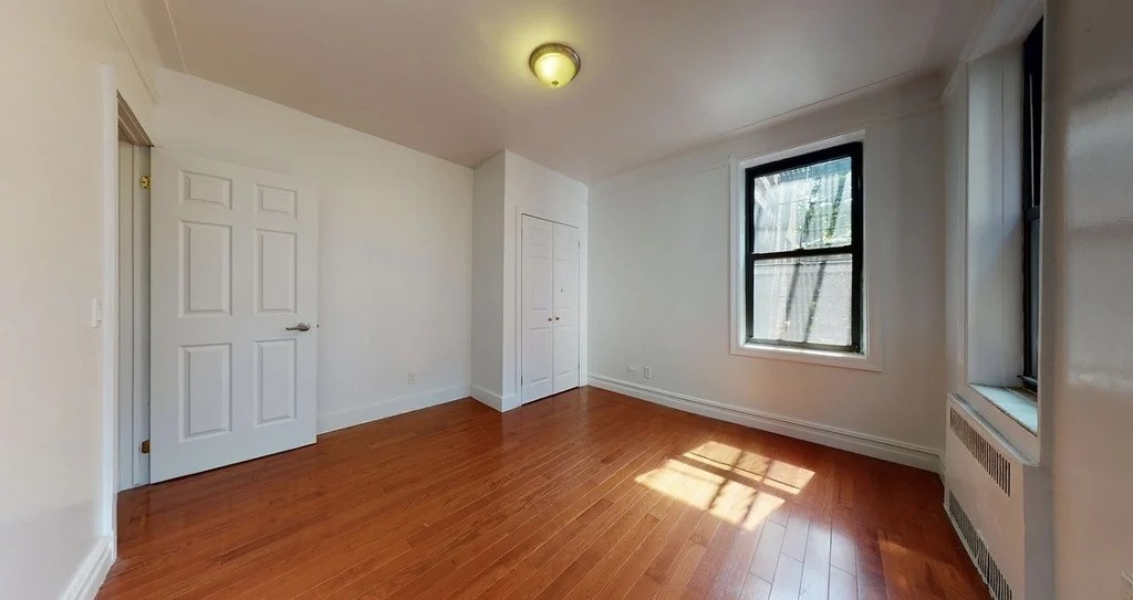 Bright bedroom in a Queens listing