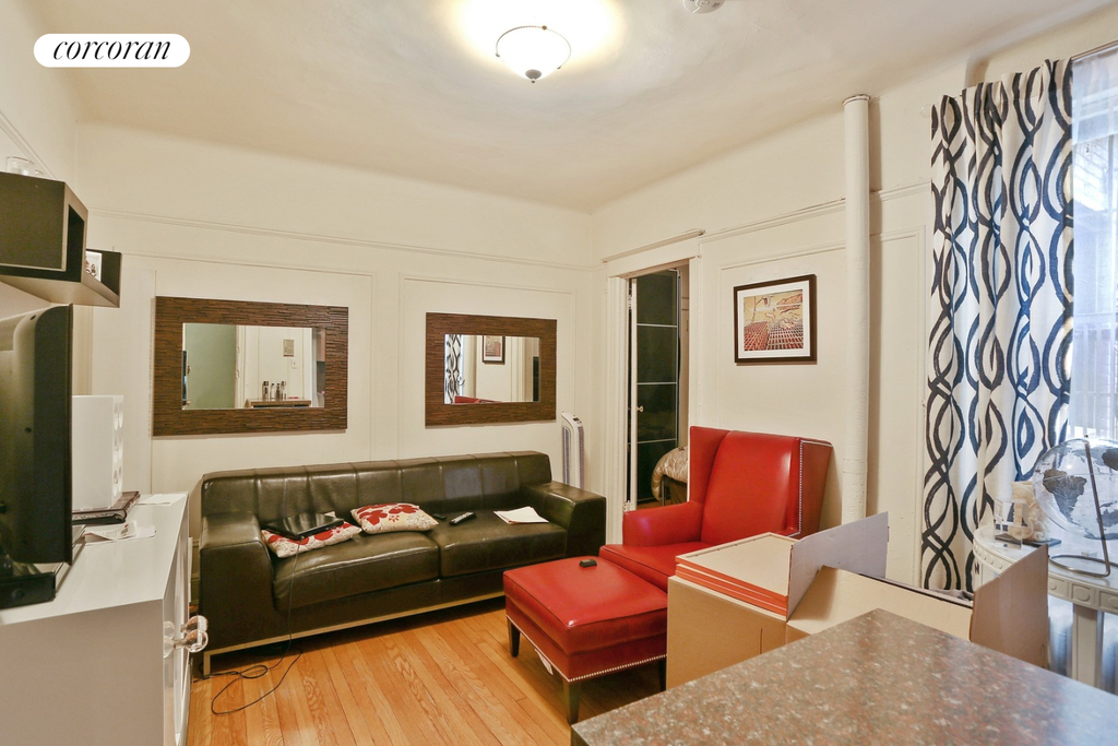 Living room with a red seat in an apartment