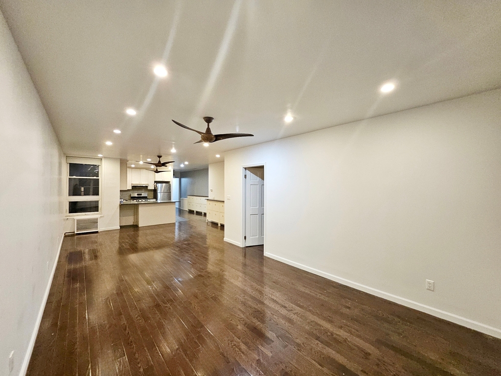 Long living room with recessed lighting