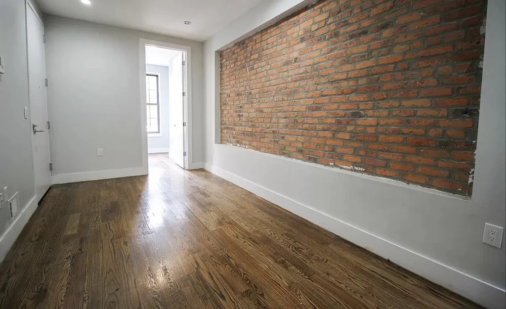 Living room with exposed brick