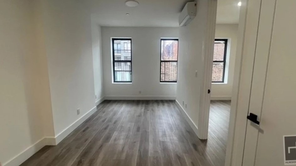 Large living room and bedroom with windows