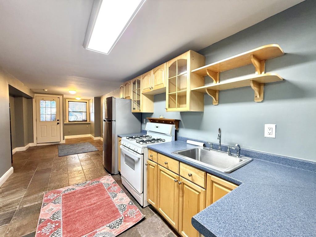 Kitchen with blue walls and counters