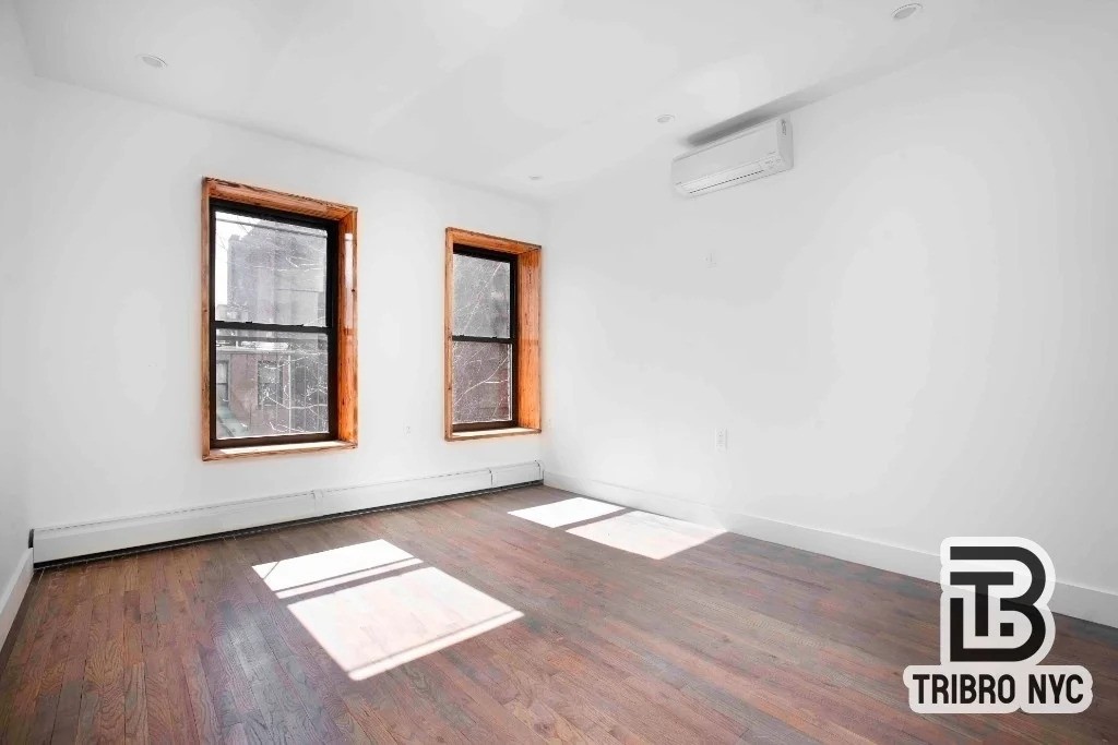 Manhattan living room with wooden trim on windows