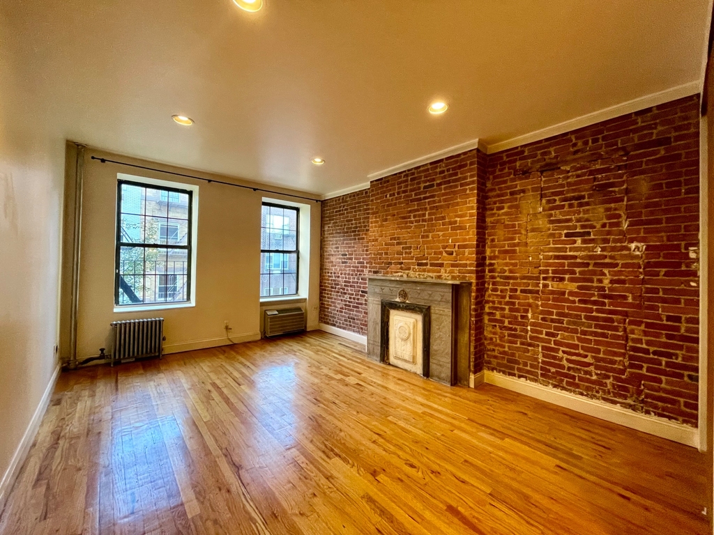 Manhattan listing with exposed brick in March 2025