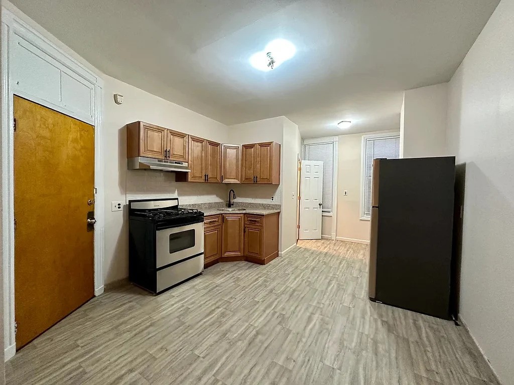 Kitchen and living room in a Queens apartment