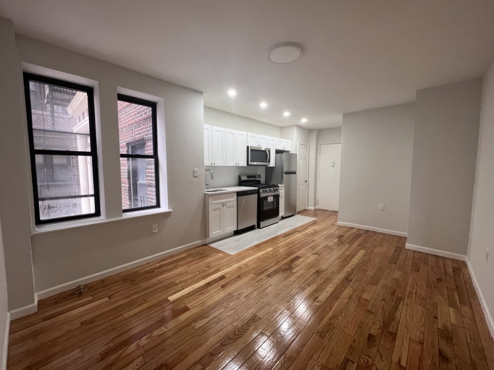 Open-concept kitchen and living room in a Queens apartment