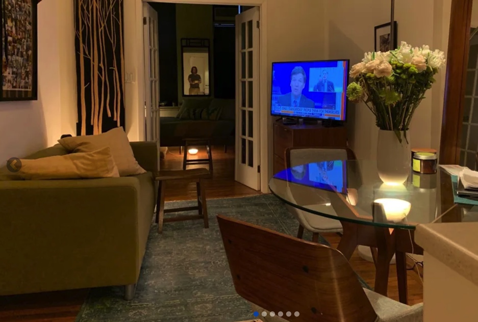 photo of living room with french doors in the background