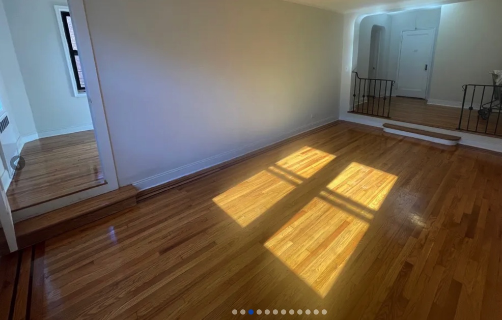 apartment listing photo of empty room with steps