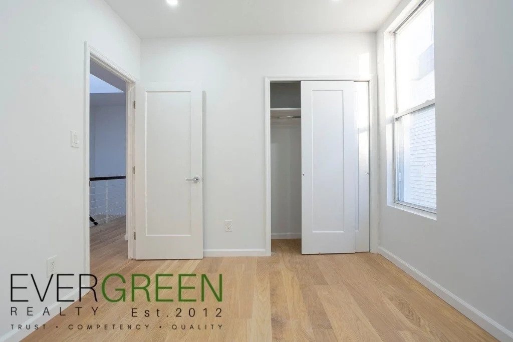 Bedroom with natural light and closet